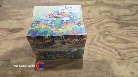 Pokemon cards, sealed shop box containing 10 tins of Pokemon cards