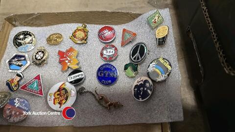 Tray of metal pin badges