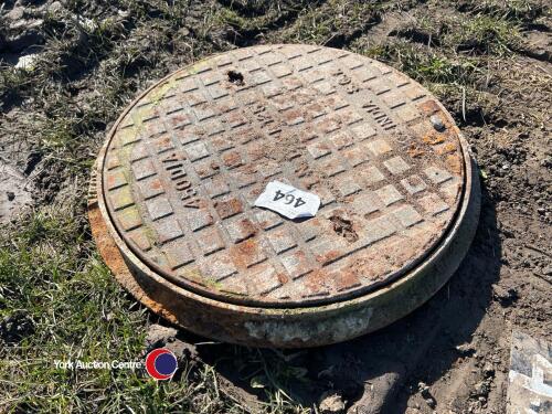 Round cast-iron manhole cover and ring