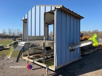 Roller table with waste elevator and covered