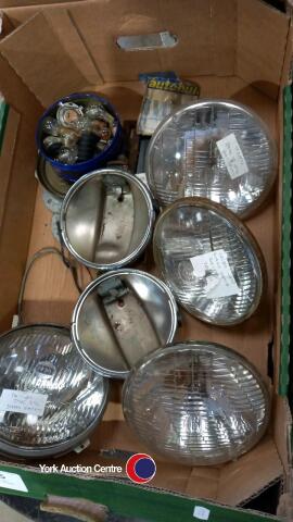 Box of classic car headlights and bulbs etc.