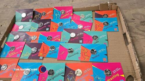 Selection of London 2012 Olympic 50pence coins in original packaging.