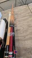 Quantity of snooker cues and a Louisville slugger baseball bat