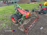 Petrol engined wide section grass cutter twin wheels