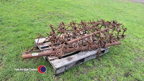 Trailed chain harrows