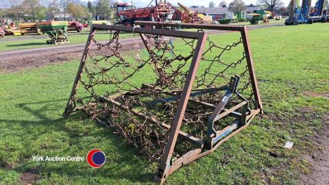 Folding chain harrow