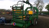 McHale 998 wrapper with round bale and static wrapping kits, controls and manuals in office, 2014 - 3