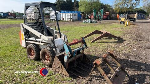 Bobcat 310 skid steer, working order, starts, runs, drives, all hydraulics work, with bucket and muck grab, key in office