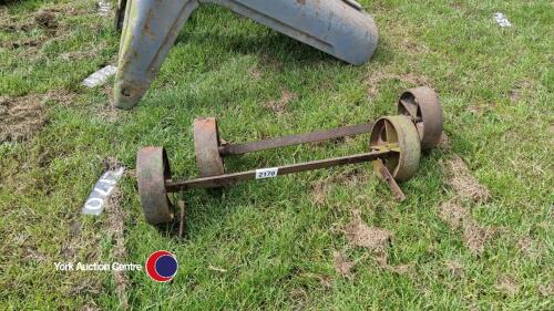 Pair of axles with cast iron wheels, from a sheep hay rack