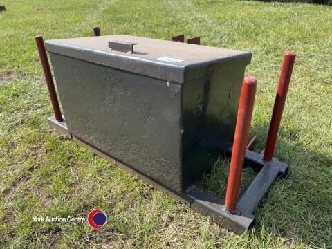 Front linkage bale wrap carrier with storage box