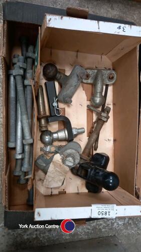 Box of new and old ball/drawbar hitches and long bolts