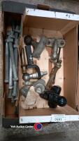 Box of new and old ball/drawbar hitches and long bolts