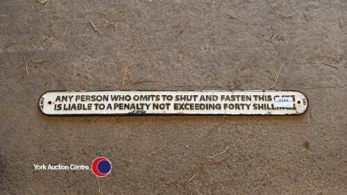 Vintage cast iron gate signs.