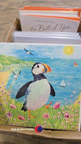 Box of mixed greeting cards with various designs