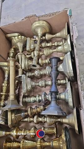 Box of old brass candlesticks