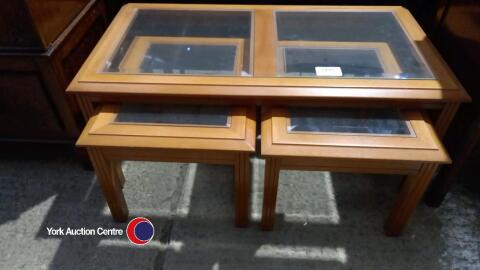 Nest of glass topped coffee tables