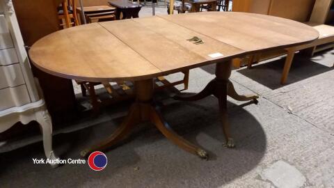 Oval oak table with claw feet and coffee table which is also middle leaf for table