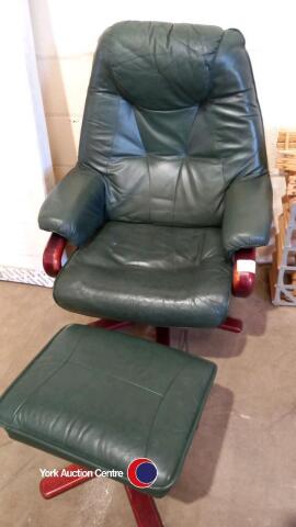 Green swivel armchair with matching foot stool