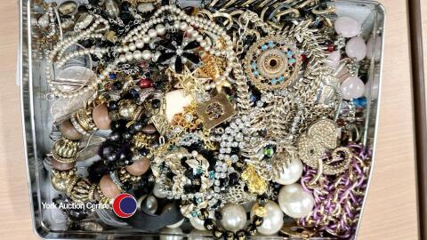 Tin of costume jewellery