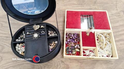 Black carrying case and musical jewellery box, both with contents of jewellery