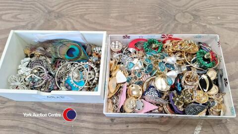 Box of 100 pairs of earrings with a box of single earrings