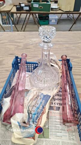 2 x tall pink bottles and a ships decanter