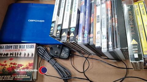 Quantity of DVDs including box sets plus DB Power portable DVD player and charger