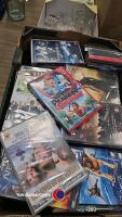 Box of various DVDs, some still sealed