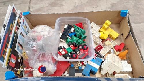Box of vintage Lego and instruction manuals
