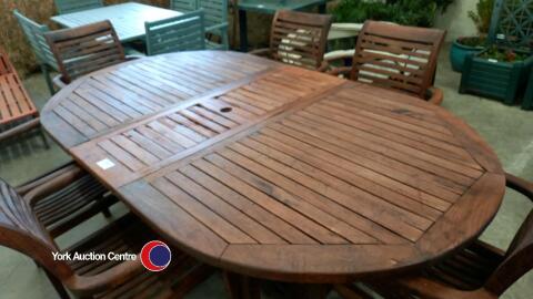 Large hardwood garden table and 6 chairs.