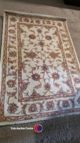 100% wool rug, 120cms x 180cms, subtle pattern on ivory background