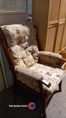 High backed upholstered wooden armchair