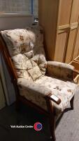 High backed upholstered wooden armchair