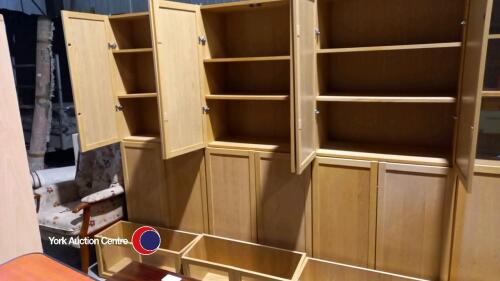 Tall bookcase with wooden doors and glass door top