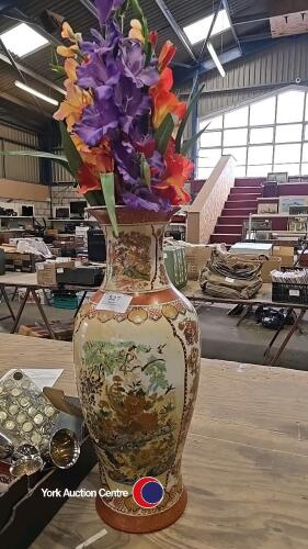 Tall vase with artificial gladioli