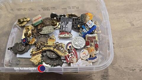 Box of enamel badges