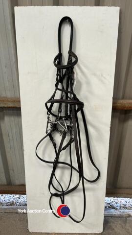 Cob brown leather double bridle with weymouth, curbchain and bridoon bits and plain leather reins.