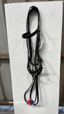 Full black rambo mickleham bridle with 5'' myler French snaffle bit and black leather plaited reins.