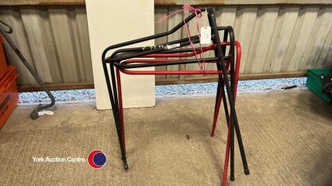 3 Black & red metal saddle stands