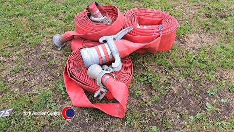 Quantity of red lay-flat irrigation hose
