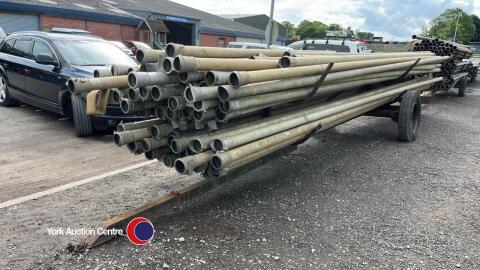 Approx 80 irrigation pipes 9m x 4in on pipe trailer