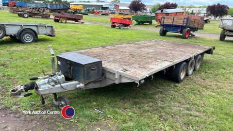 Graham Edwards triaxle flat bed trailer. Strap box on front.