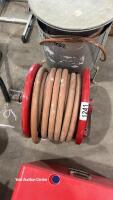 Fire hose on a reel for mounting on a wall. - 2