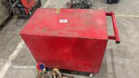 Red tool box on with wheels. Key in office - 3