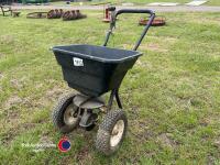 Push along seed spreader