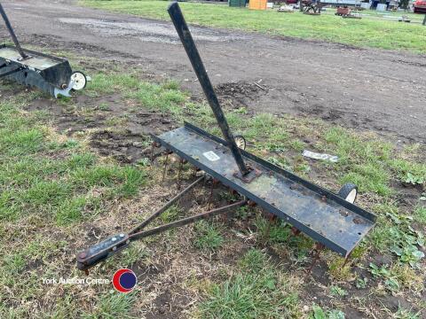 Tow behind scarifier