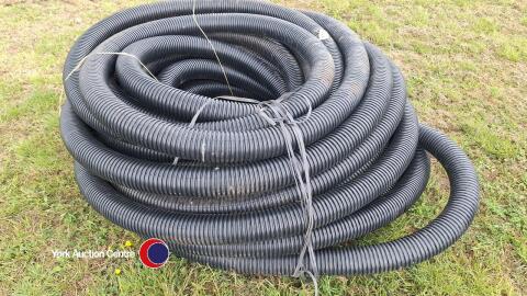 Large coil of black land drainage pipe