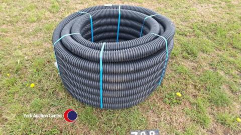 Small coil of black land drainage pipe