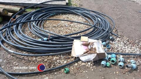 Quantity of 40mm black plastic pipe with several fittings