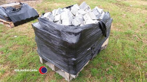 Crate of cubed grey granite cobbles